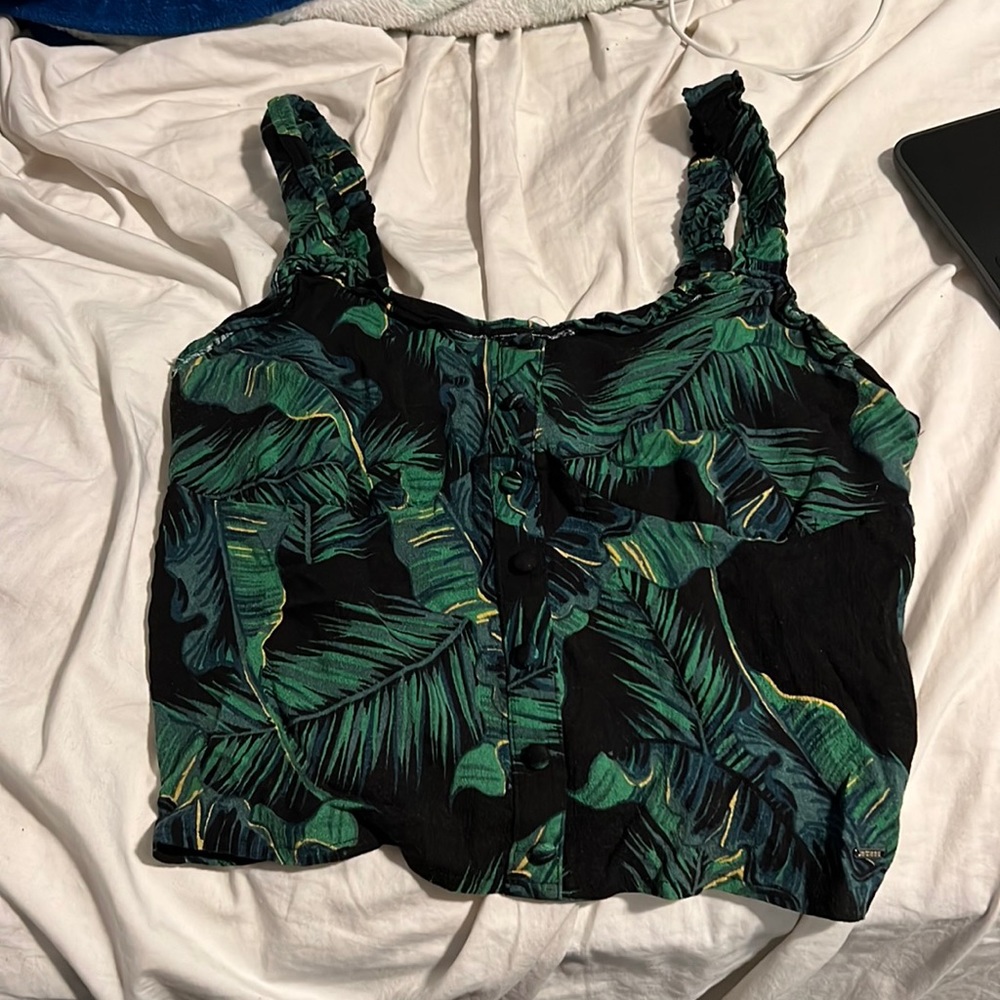 Guess tank top has stretchy straps and starchy back